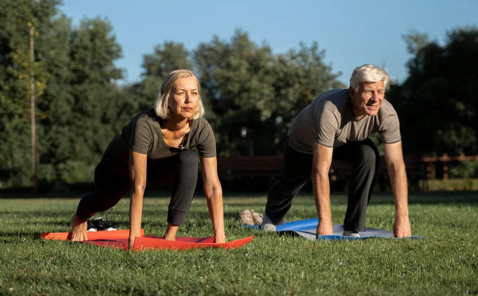 An older couple doing yoga together